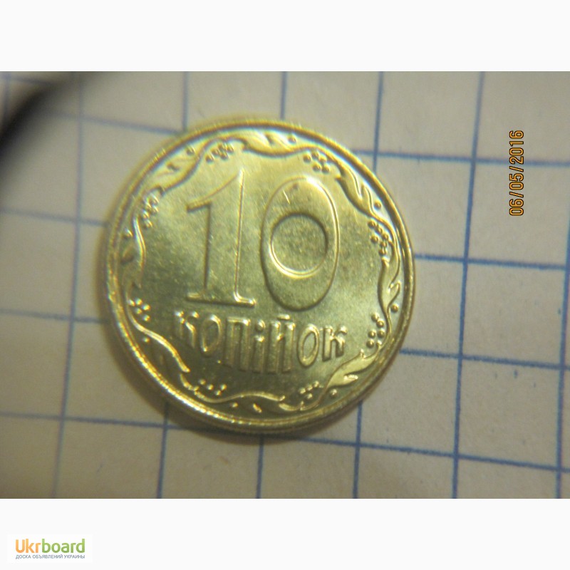 Фото 3. Брак монеты 10 копійок 2014г. - вкрапление + наплыв металла