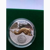 Монета дельфін