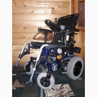 Инвалидная электро коляска вертиколизатор