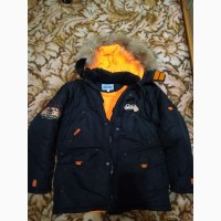 Продам б/у практичную и удобную зимнюю куртку DONILO с капюшоном