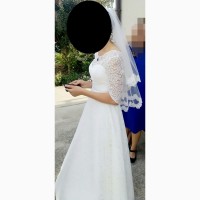 Кружевное свадебное платье с фатой